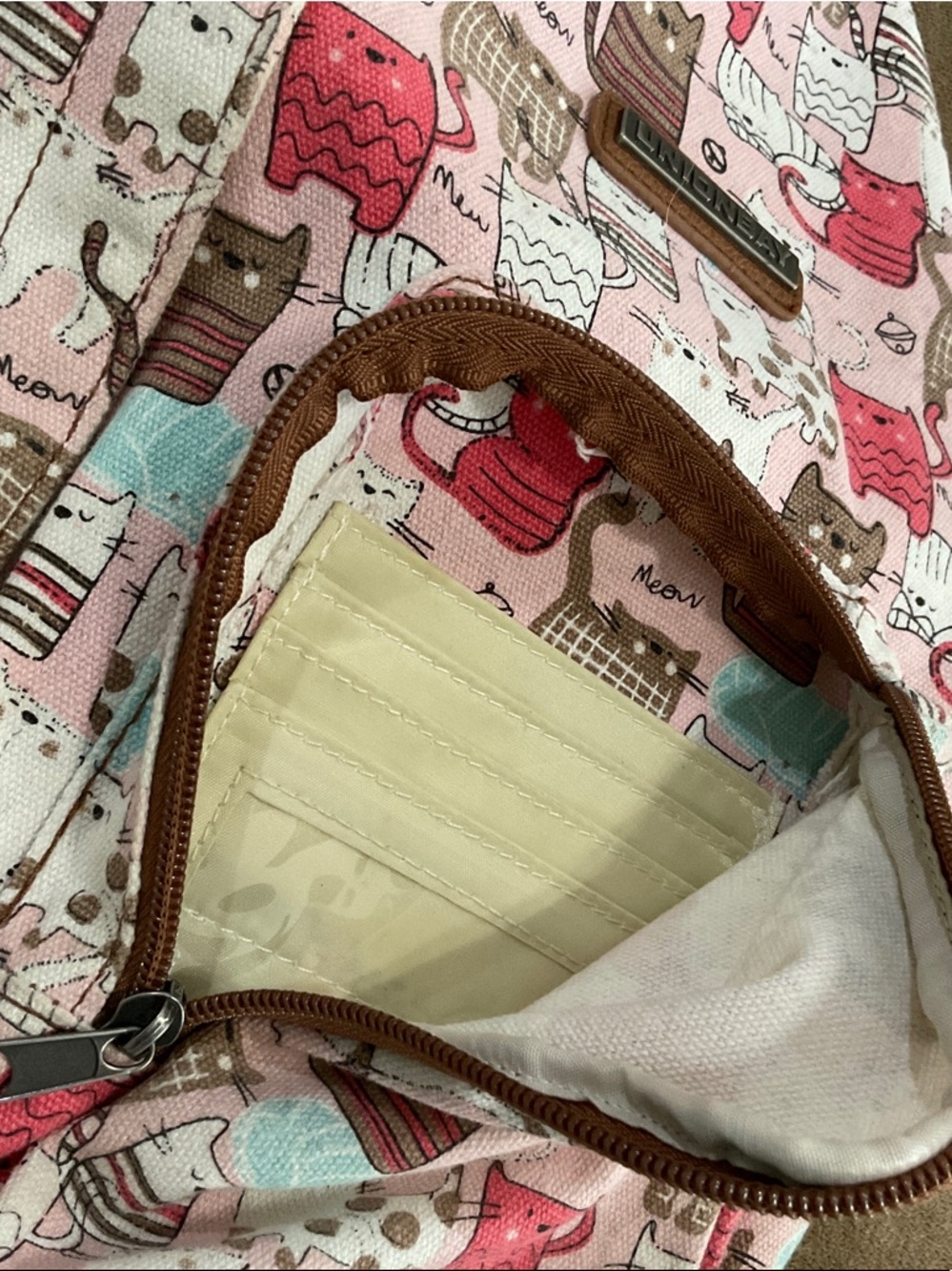 UNIONBAY Cat Print Sling Backpack in Pink, Brown, and Mint - Picture 12 of 12